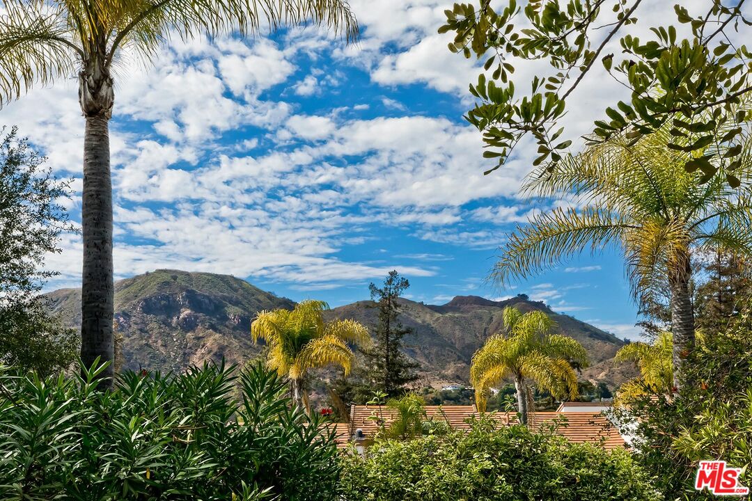 17171 Palisades Circle Pacific Palisades, CA 90272 - Photo 3 of 29 a view of swimming pool with a yard