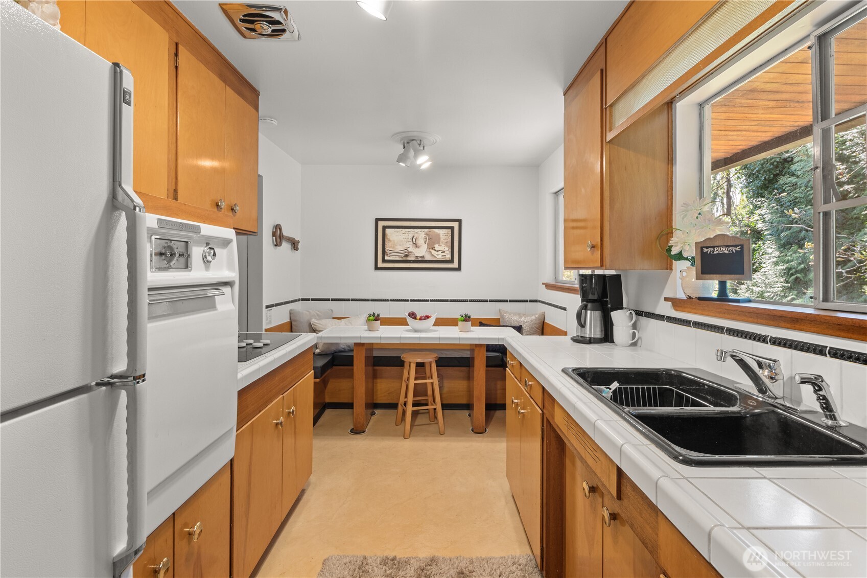 15829 4th Avenue Southwest Burien, WA 98166 - Photo 12 of 37 a view of a kitchen with a sink and large window