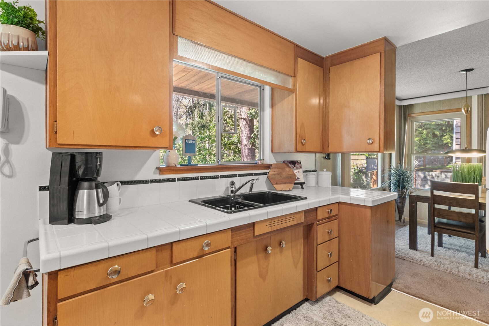 15829 4th Avenue Southwest Burien, WA 98166 - Photo 13 of 37 a kitchen with stainless steel appliances a sink a stove and a window