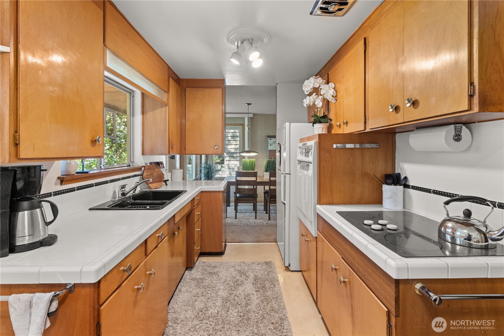 15829 4th Avenue Southwest Burien, WA 98166 - Photo 15 of 37 a kitchen with stainless steel appliances granite countertop a sink stove and cabinets