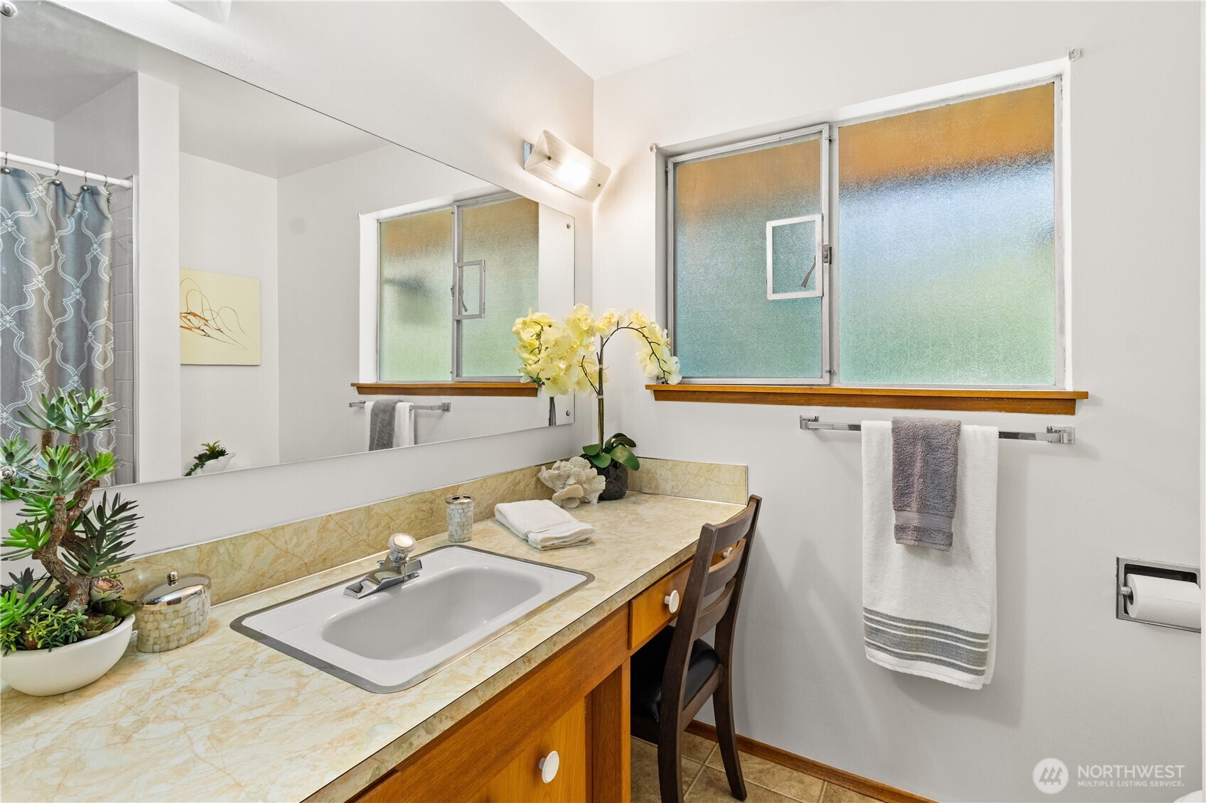 15829 4th Avenue Southwest Burien, WA 98166 - Photo 17 of 37 a bathroom with a granite countertop sink and a mirror