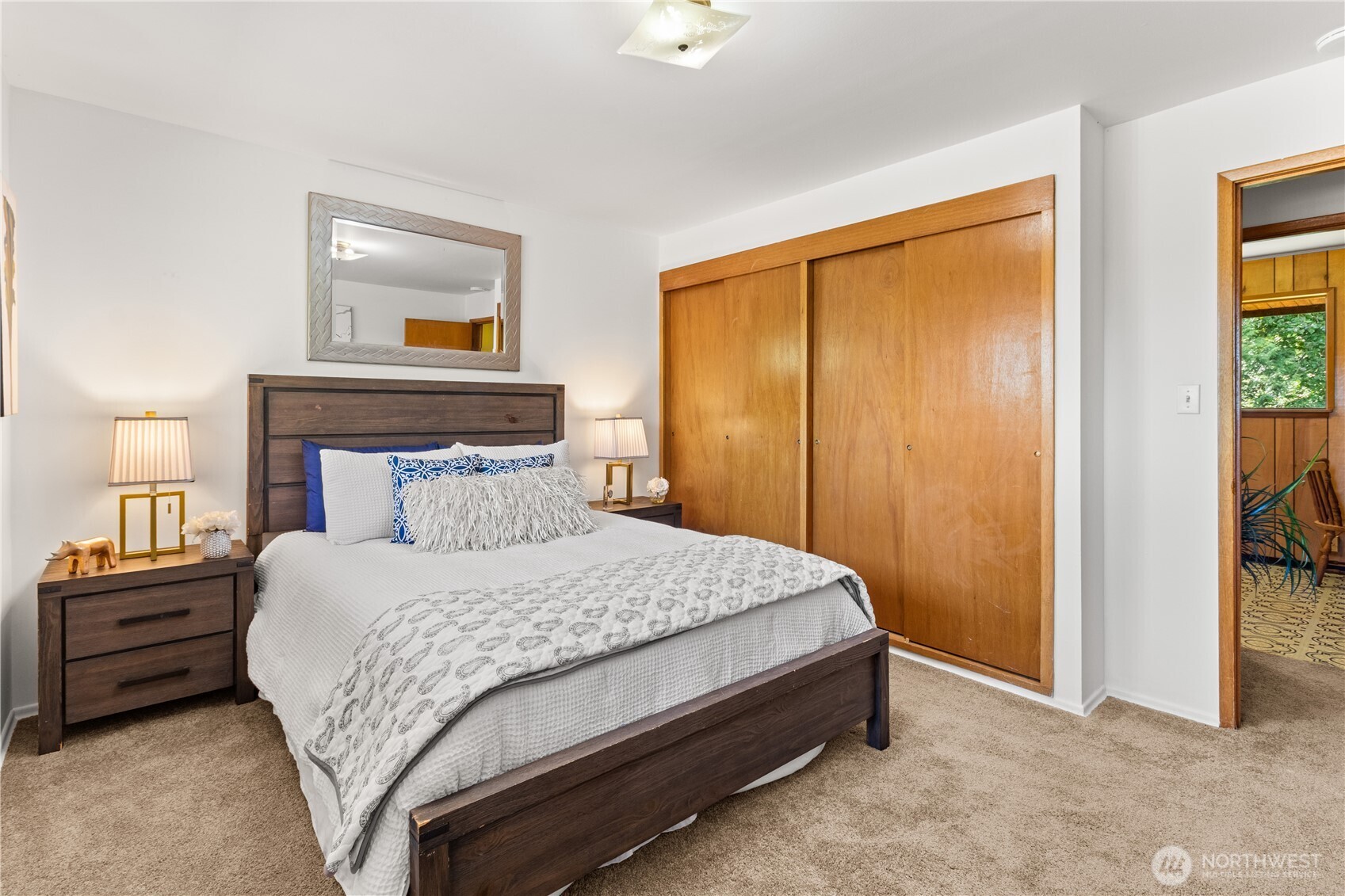 15829 4th Avenue Southwest Burien, WA 98166 - Photo 19 of 37 a bedroom with a bed and a painting on the wall
