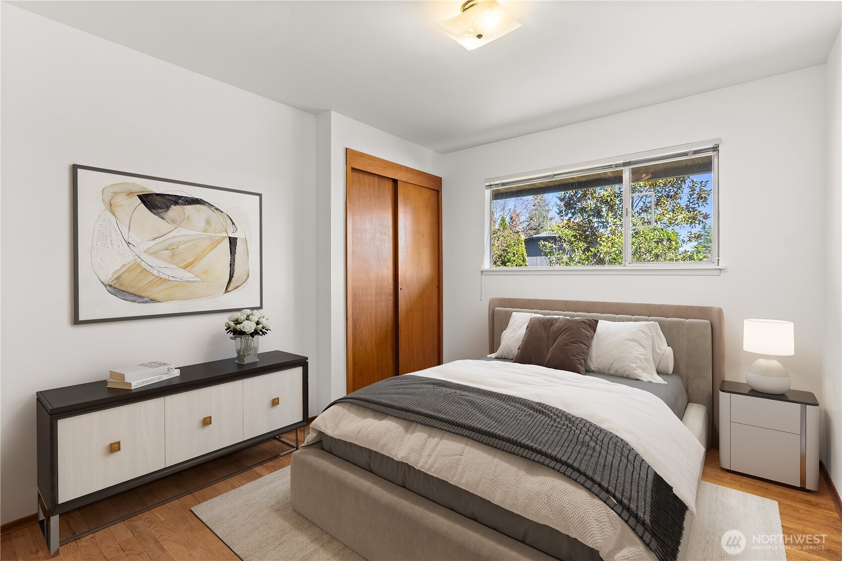 15829 4th Avenue Southwest Burien, WA 98166 - Photo 20 of 37 a bedroom with a bed and a painting on the wall