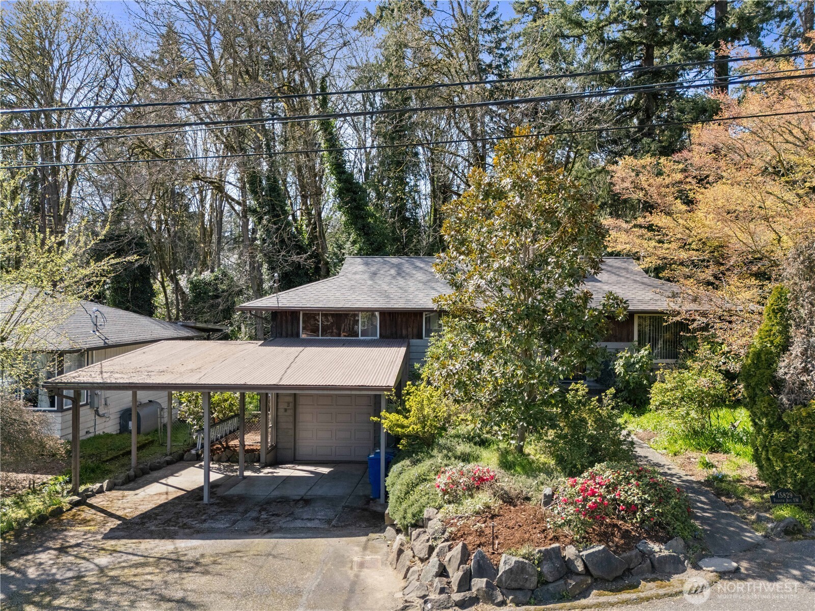 15829 4th Avenue Southwest Burien, WA 98166 - Photo 2 of 37 a view of a patio with table and chairs under an umbrella