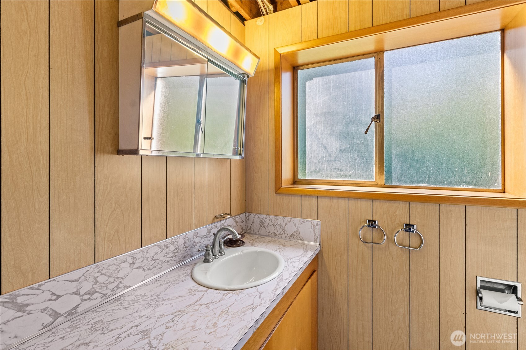 15829 4th Avenue Southwest Burien, WA 98166 - Photo 27 of 37 a bathroom with a sink and a mirror