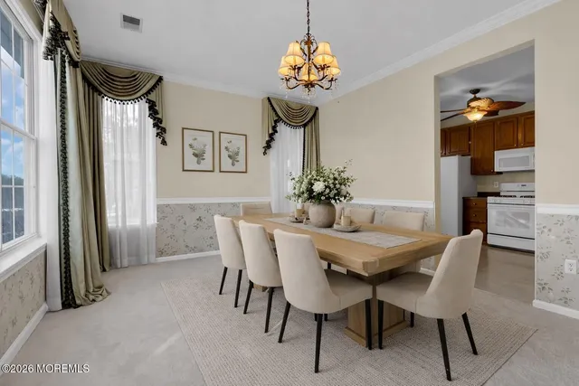 a kitchen with a sink cabinets and window