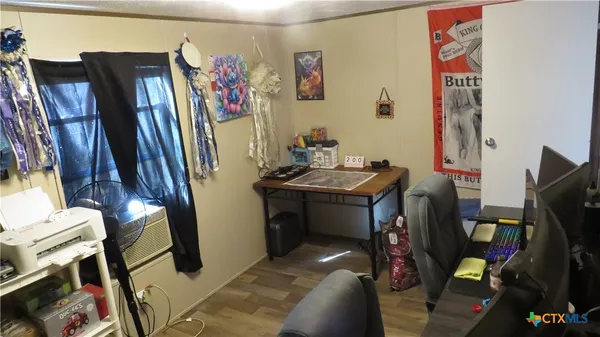 a view of a living room with entryway and furniture