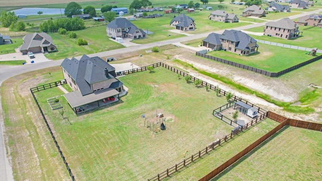 1205 Redbud Street Howe, TX 75459 - Photo 40 of 40 a view of swimming pool with a garden and seating area