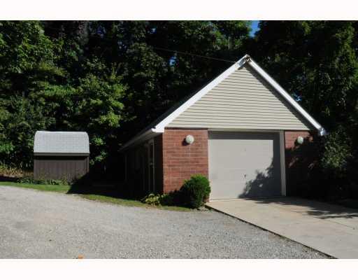 2112 Brodhead Road Aliquippa, PA 15001 - Photo 6 of 15 Exterior Front. THE GARAGE HAS TWO LEVELS. LOTS OF STORAGE UPSTAIRS. COMMERCIAL SIZE GARAGE DOOR. HEATED AND AIR CONDITIONED A HANDYMAN S DREAM!!! TOOL SHED ALSO INCLUDED. CONCRETE DRIVE INTO GARAGE.