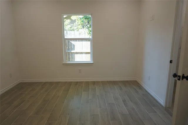 a view of a pathway gate with wooden fence