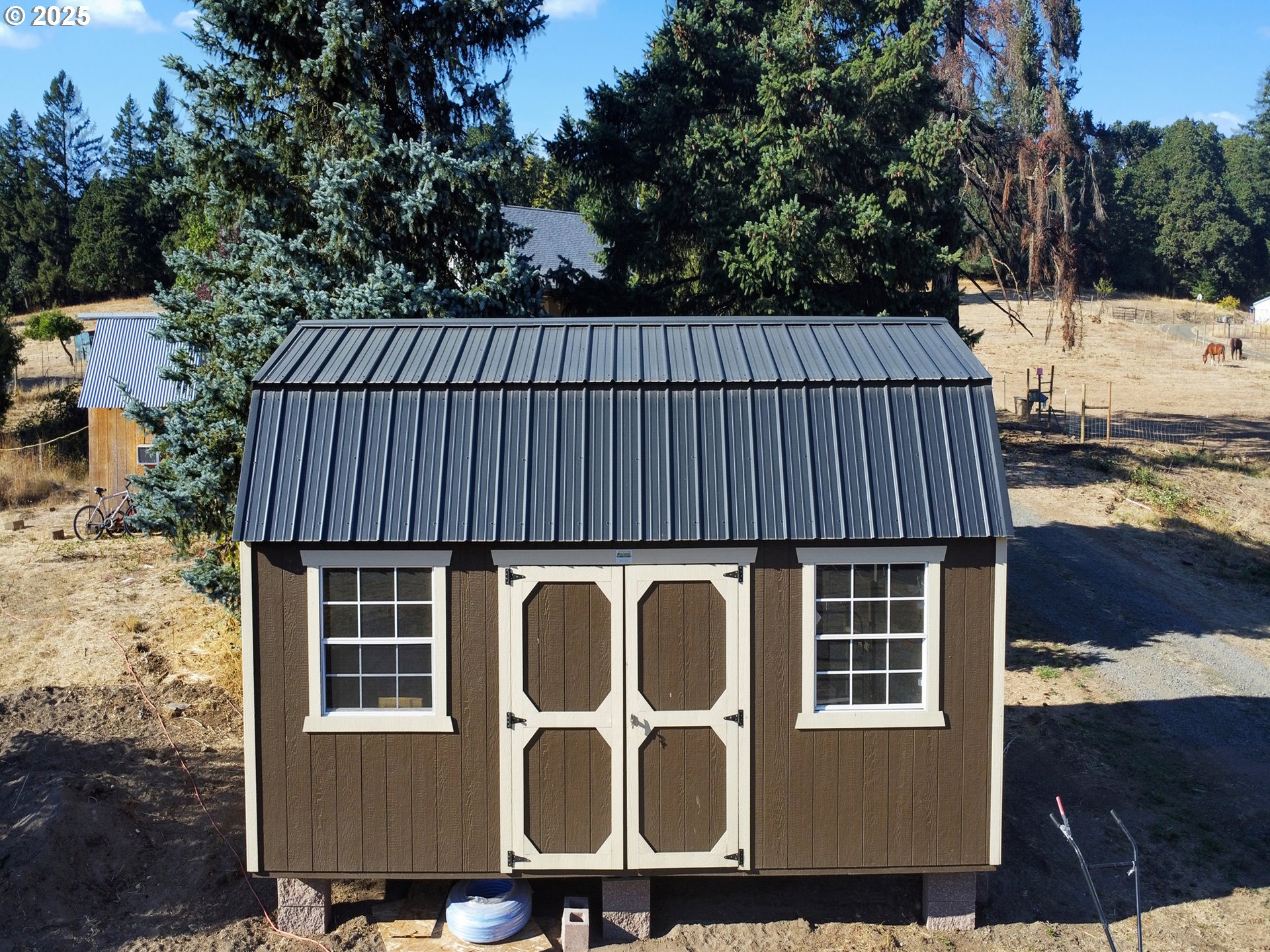 845 Perrydale Road Dallas, OR 97338 - Photo 16 of 20 a view of a house with backyard and sitting area
