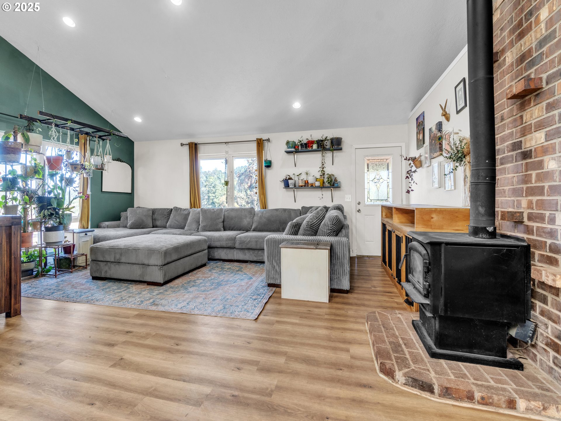 845 Perrydale Road Dallas, OR 97338 - Photo 6 of 20 a living room with furniture and a fireplace