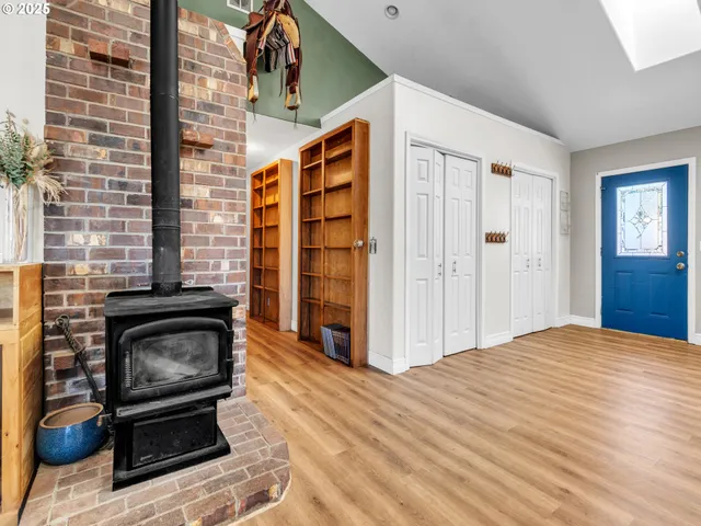 a view of an empty room and fire place