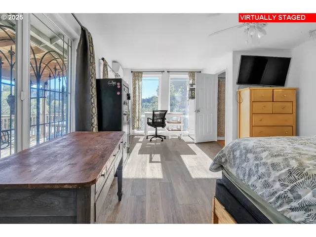 a living room with a bed and furniture