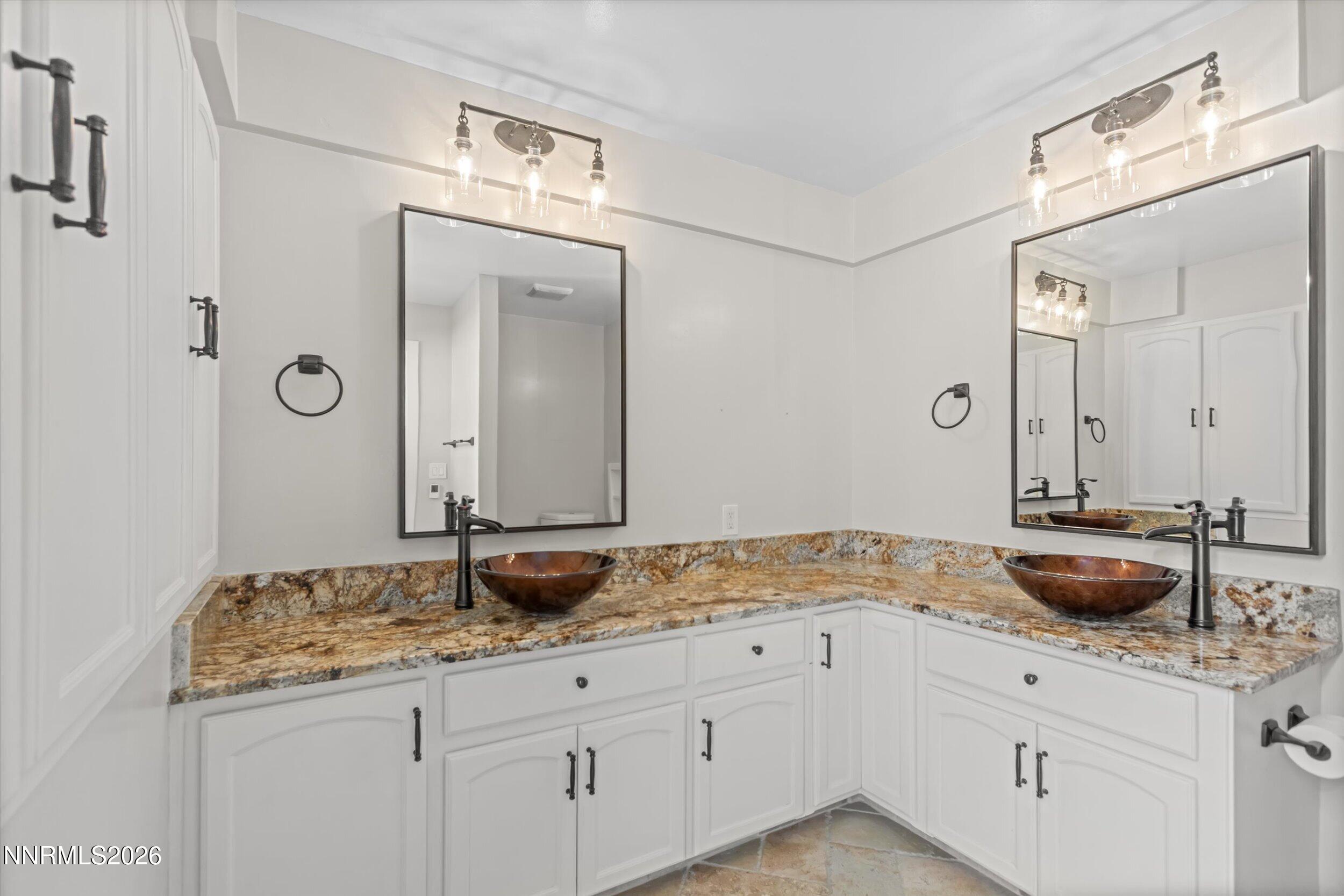 2725 West Lake Ridge Shores Reno, NV 89519 - Photo 25 of 49 a bathroom with a granite countertop sink and a mirror