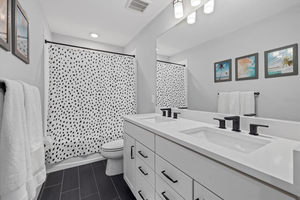 3508 Anchor Bay Trail Lakewood Ranch, FL 34211 - Photo 31 of 74 a bathroom with a sink a toilet and shower