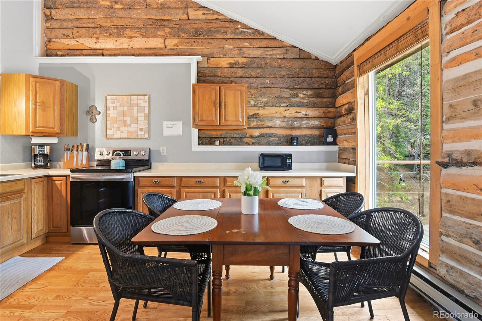 185 Alice Road Idaho Springs, CO 80452 - Photo 8 of 43 a kitchen that has a table and chairs in it
