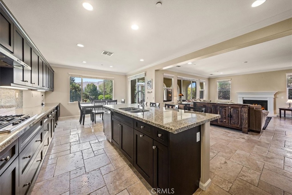 3152 Vista Terrace Riverside, CA 92503 - Photo 13 of 55 a large kitchen with stainless steel appliances granite countertop a large counter top a stove and a sink