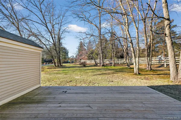 a view of yard with wooden fence