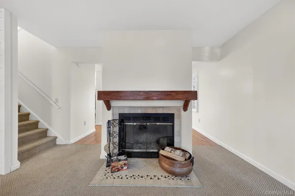 a living room with furniture a fireplace and a fireplace