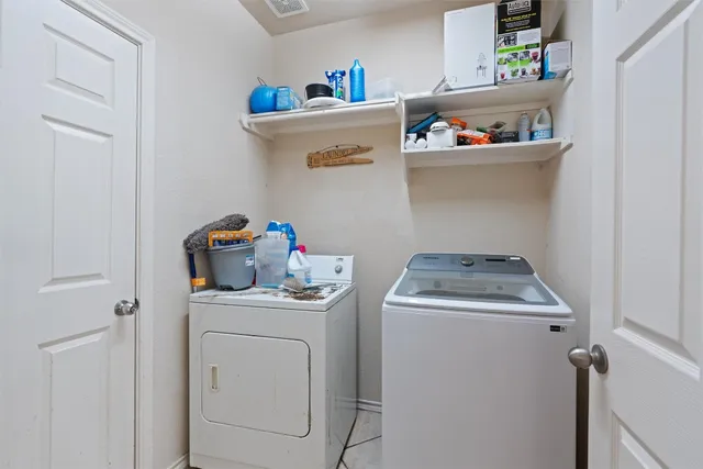 a utility room with dryer and washer