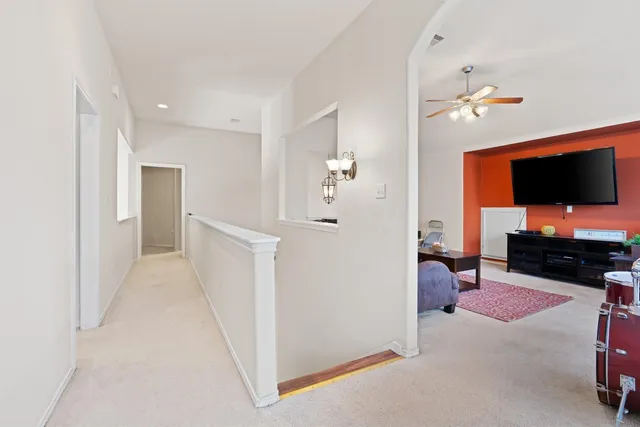 a view of a livingroom with furniture and a flat screen tv