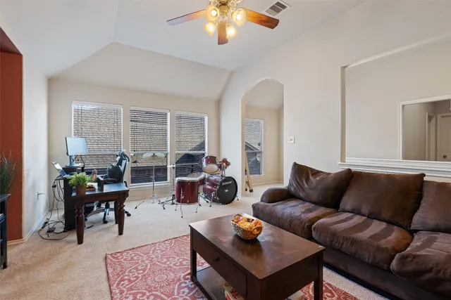 a living room with furniture and a large window