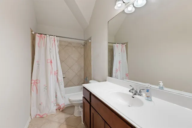 a bathroom with a sink a toilet and a tub