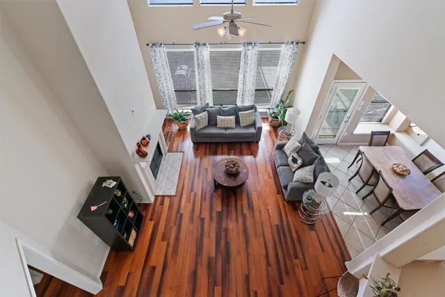 a view of living room with furniture and wooden floor