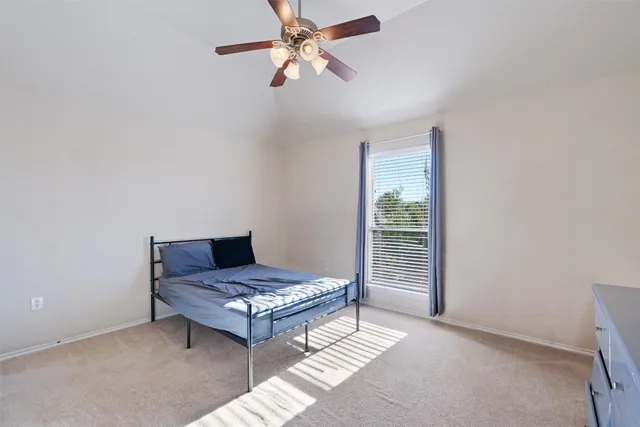 a room with a bed and a window