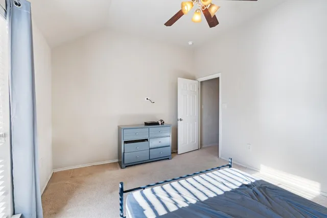 a view of an empty room and wooden floor