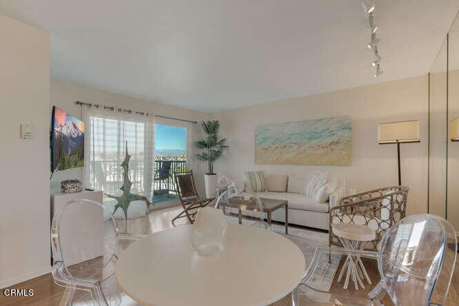 3101 Peninsula Road, Unit 208 Oxnard, CA 93035 - Photo 8 of 30 a living room with furniture and a large window