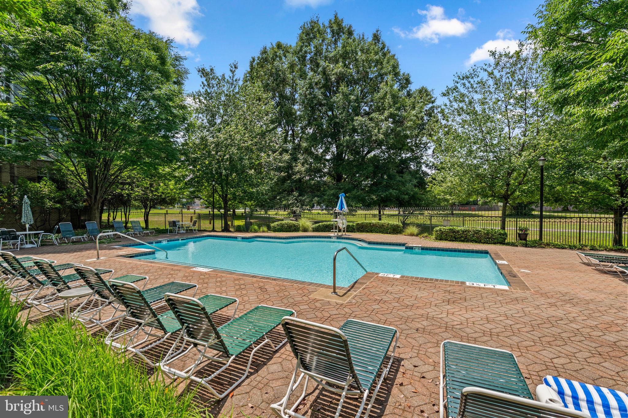 5575 Seminary Road, Unit 102 Falls Church, VA 22041 - Photo 30 of 31 a view of a tennis ground with large trees
