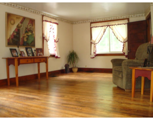 185 Call Road Colrain, MA 01340 - Photo 4 of 12 a living room with fireplace furniture and a window