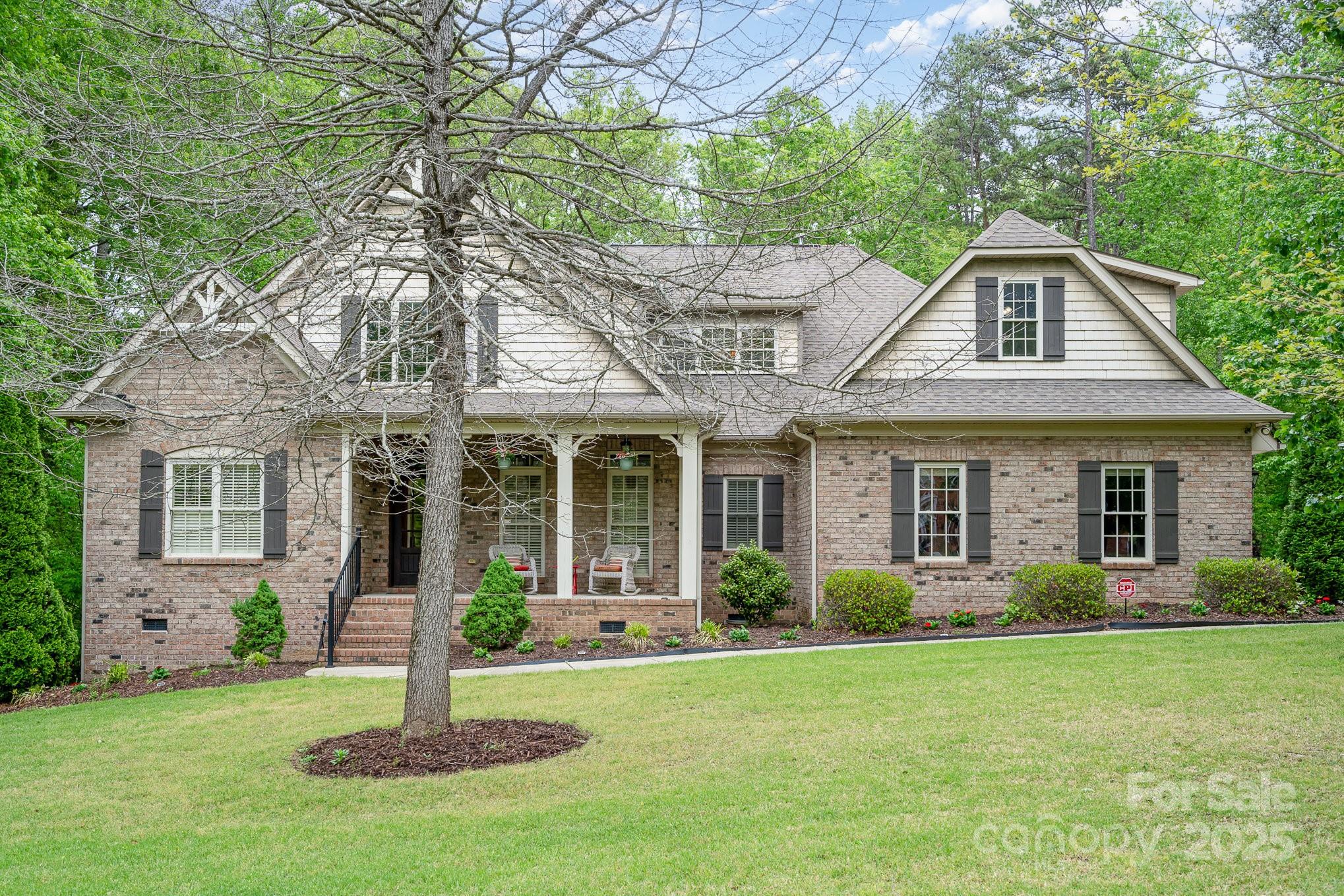 112 Spring Branch Road Fort Mill, SC 29715 - Photo 2 of 43 a front view of a house with a garden