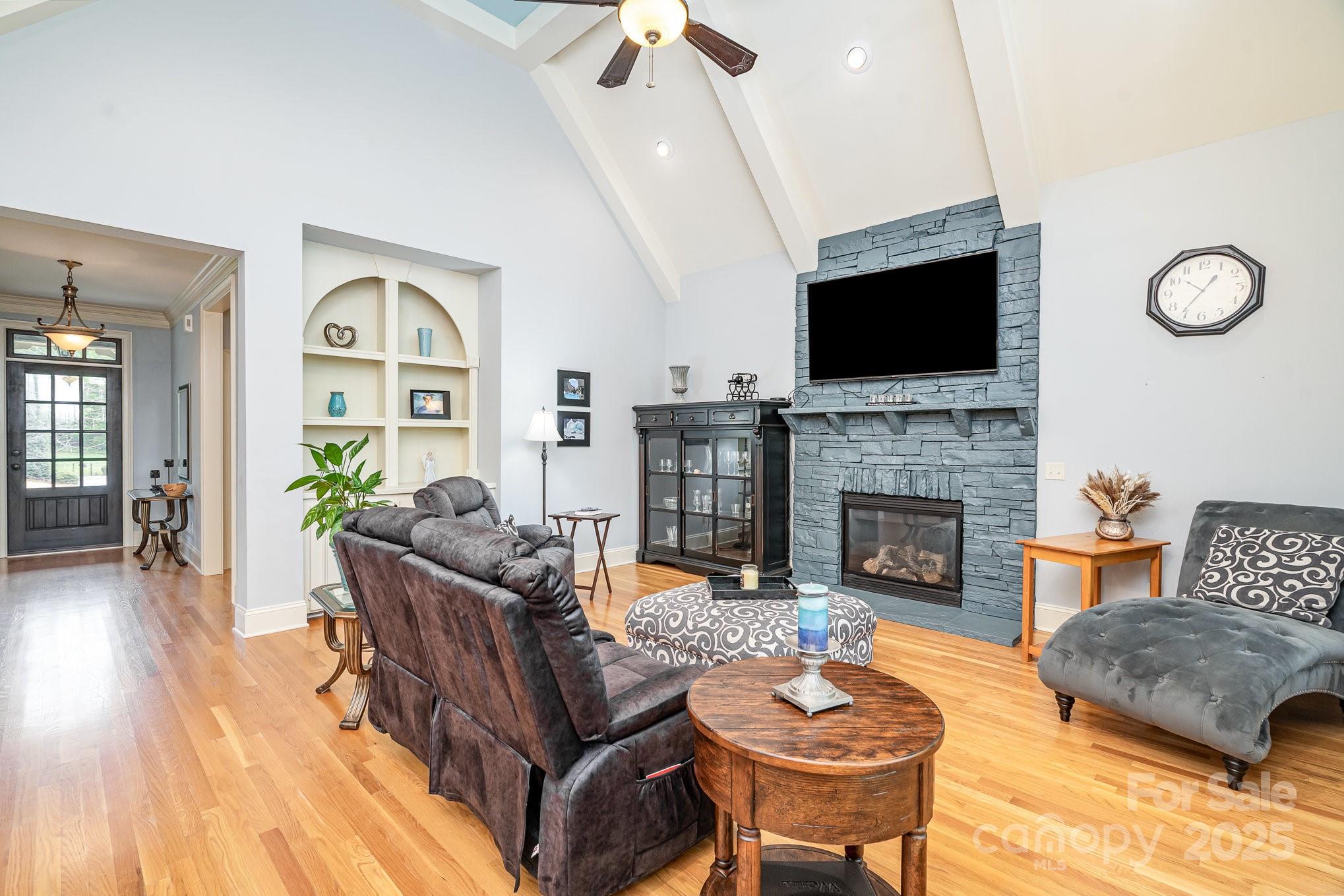 112 Spring Branch Road Fort Mill, SC 29715 - Photo 33 of 43 a living room with furniture a fireplace and a flat screen tv
