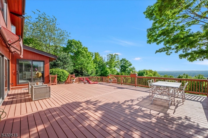 950 Sunset Ridge Bridgewater, NJ 08807 - Photo 18 of 41 a wooden deck with sunset view