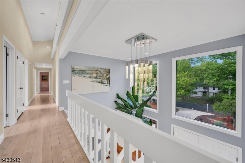 950 Sunset Ridge Bridgewater, NJ 08807 - Photo 23 of 41 a view of a livingroom with wooden floor and stairs