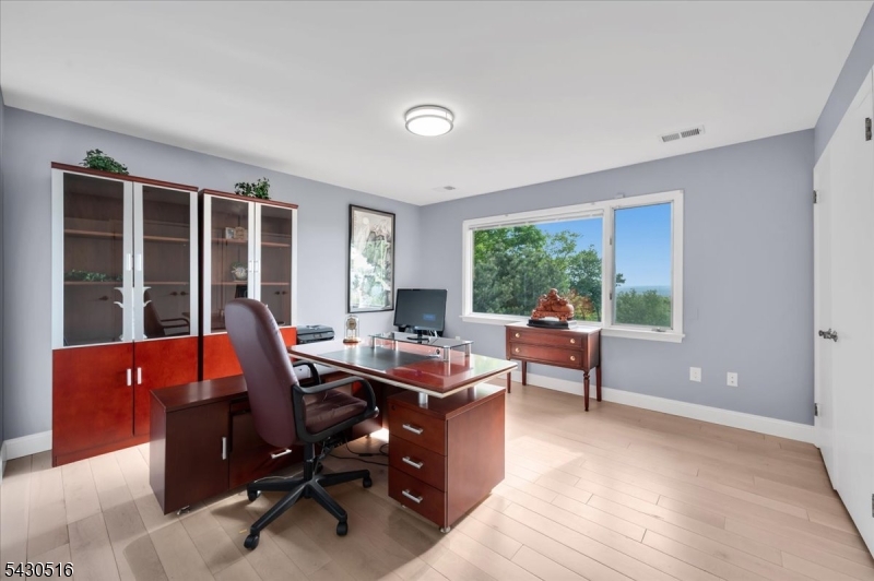 950 Sunset Ridge Bridgewater, NJ 08807 - Photo 24 of 41 a view of a workspace with furniture and a window