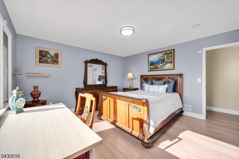 950 Sunset Ridge Bridgewater, NJ 08807 - Photo 25 of 41 a bedroom with a bed and a table in it