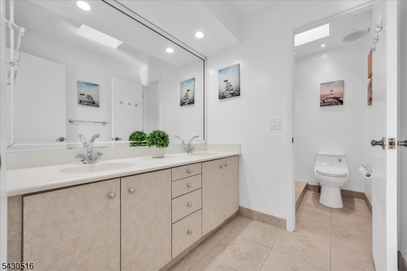 950 Sunset Ridge Bridgewater, NJ 08807 - Photo 26 of 41 a bathroom with a toilet sink and mirror