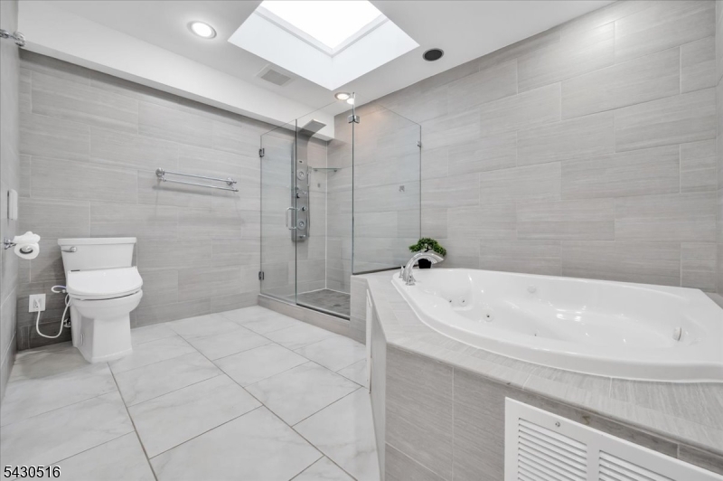 950 Sunset Ridge Bridgewater, NJ 08807 - Photo 32 of 41 a white bath tub sitting next to a white toilet