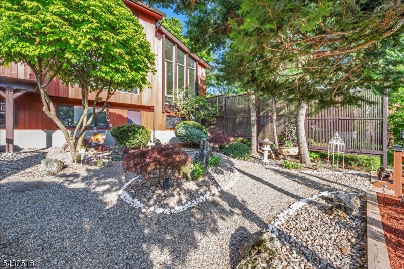 950 Sunset Ridge Bridgewater, NJ 08807 - Photo 35 of 41 a view of a backyard with plants and large trees