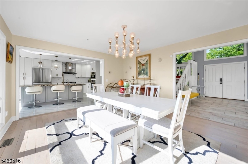 950 Sunset Ridge Bridgewater, NJ 08807 - Photo 9 of 41 a large dining space with furniture a chandelier and wooden floor
