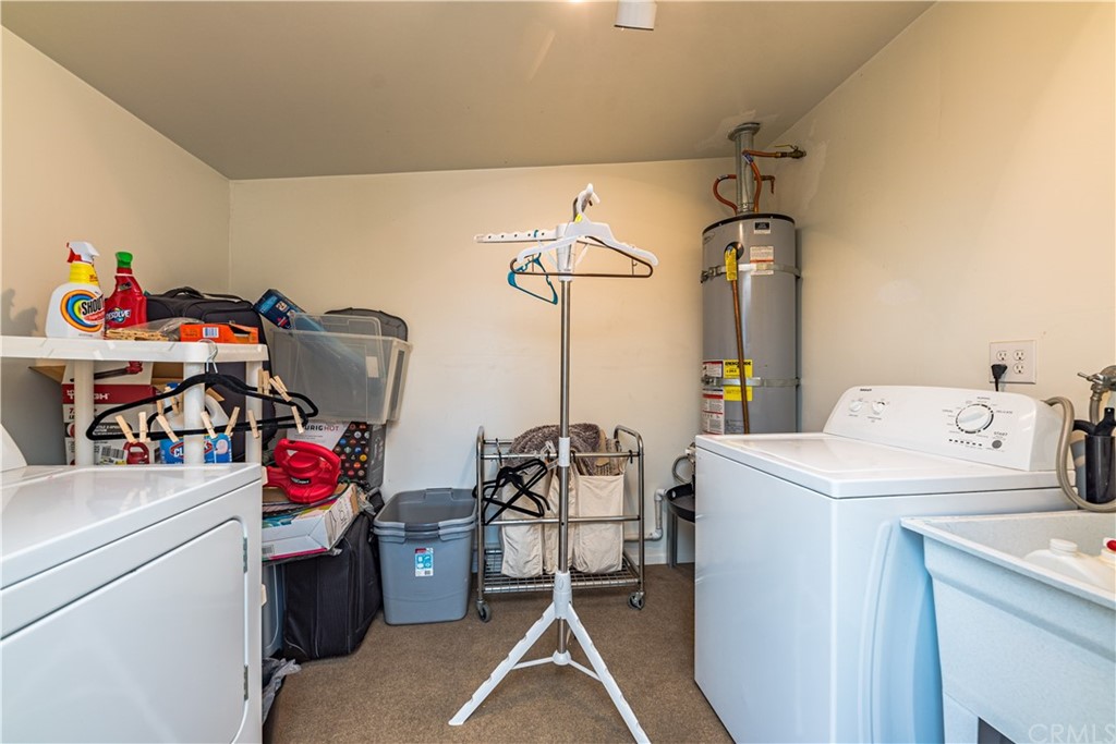 28241 Winged Foot Drive Menifee, CA 92586 - Photo 12 of 25 a utility room with dryer and washer