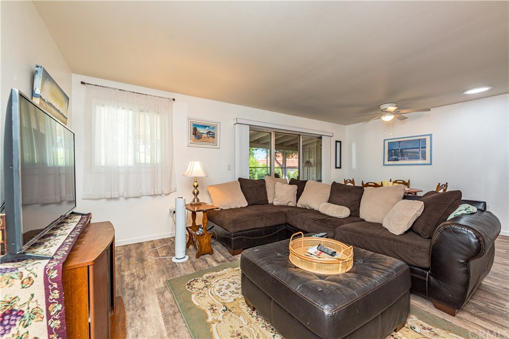28241 Winged Foot Drive Menifee, CA 92586 - Photo 8 of 25 a living room with furniture and a flat screen tv