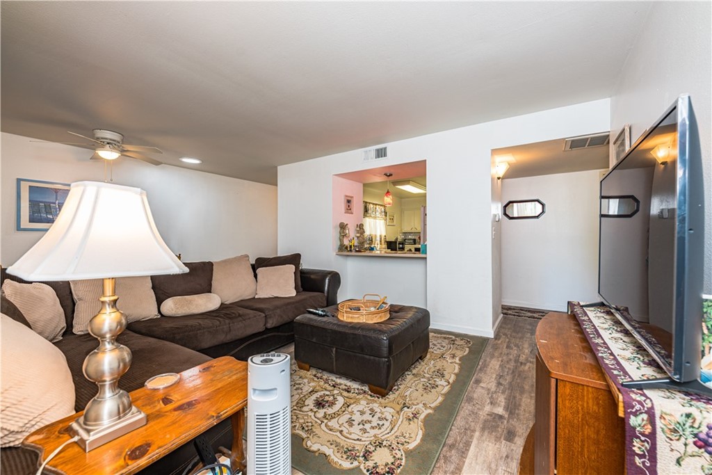 28241 Winged Foot Drive Menifee, CA 92586 - Photo 9 of 25 a living room with furniture and a lamp