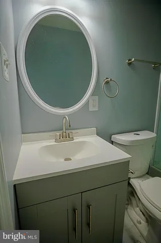 a bathroom with a toilet and a sink
