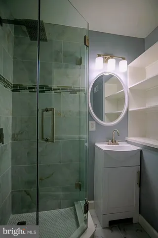 a bathroom with a sink and mirror