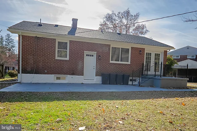 a house view with a swimming pool in front of it